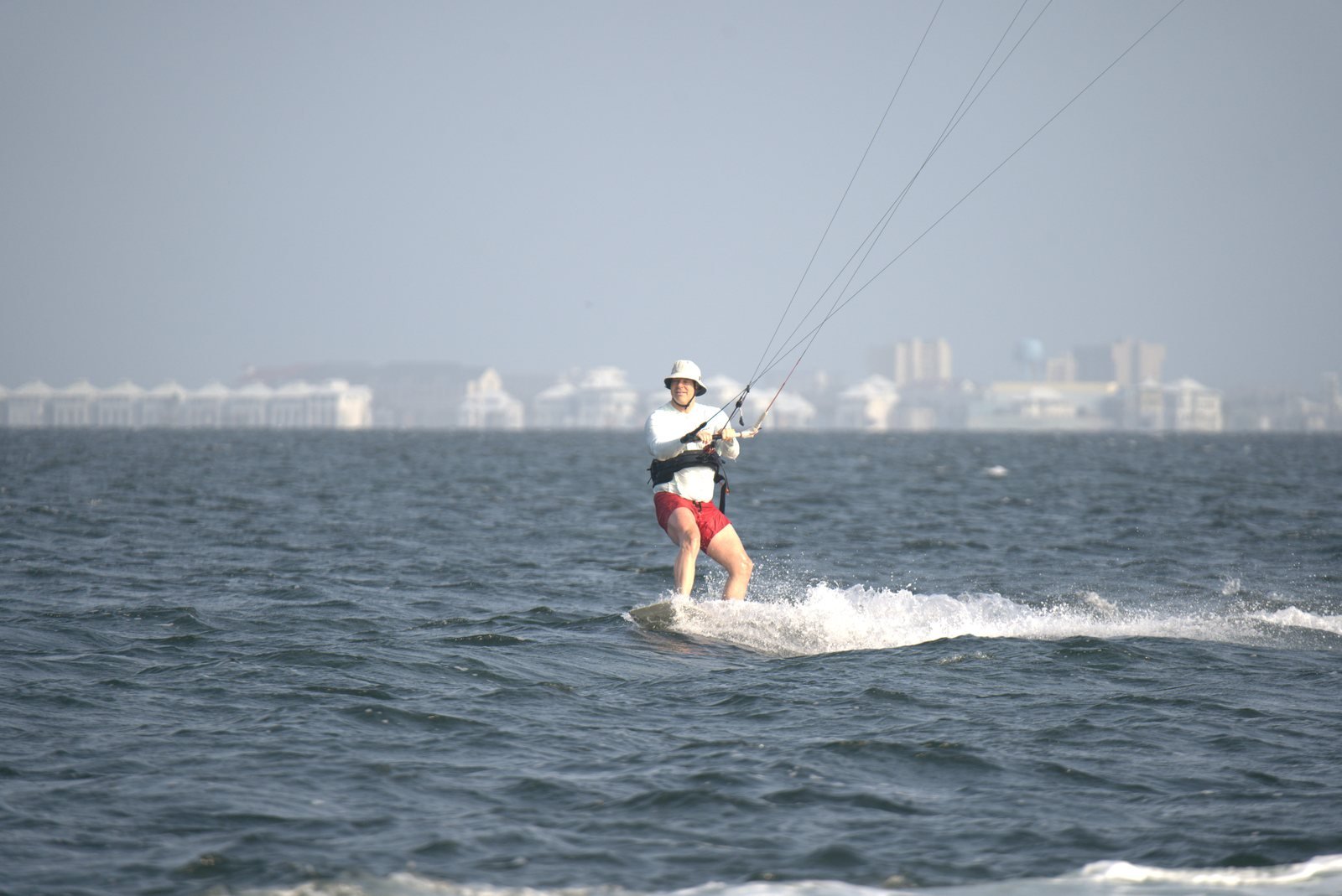 Kiteboarder riding across open water
